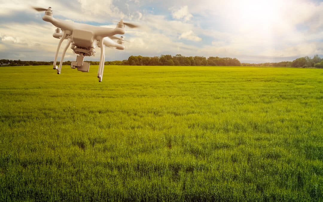 UAV drone multicopter flying with high resolution digital camera over a crops field, agriculture concept